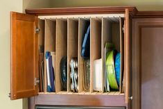 a wooden cabinet filled with lots of different items