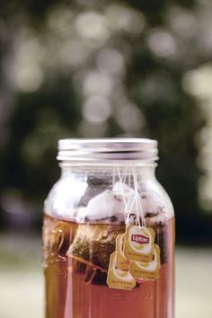 a jar filled with liquid sitting on top of a table