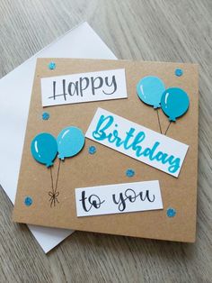 two birthday cards with balloons on them and the words happy birthday to you written in blue