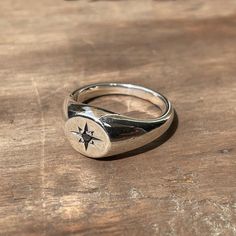 A classic small circle signet ring star-set with a 2mm black diamond. These timeless signet rings are meticulously crafted by hand in our Melbourne workshop, created out of wax and then cast into solid precious metal. Made with the highest quality Australian sterling silver to last forever. Made solid, not hollow like many others, all of our rings are hand-stamped with a Sterling Silver (925) hallmark and Custom Creed makers mark and come gift-wrapped in a branded box with satin black ribbon. Du Timeless Ring, Small Circle, Signet Rings, Diamond Star, Black Ribbon, Precious Metal, Perfectly Imperfect, Signet Ring, Black Diamond