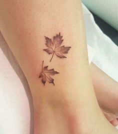 a small leaf tattoo on the ankle