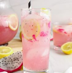 a glass filled with pink lemonade and topped with a straw