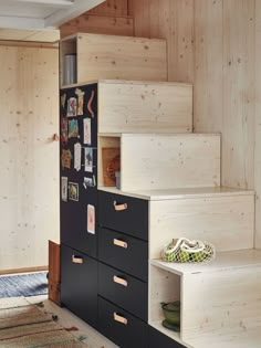 the stairs are made out of plywood and have drawers on each side for storage