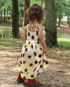 Embrace the vibrant spirit of summer with our stunning Sunflower Peplum & Sundress PDF sewing pattern. Designed to unleash your creativity, this sewing pattern offers five different skirt lengths, allowing you to create a peplum, vintage-inspired skirt, dress, cascading dress, or a flowy maxi skirt. For those seeking a unique touch, the cascading dress variation comes with an optional large hem band, adding an extra level of elegance to your creation. Sunflower offers multiple ways to style the Summer Picnic Dress With Smocked Back, Fitted Bohemian Sundress For Picnic, Summer Cotton Dress With Gathered Skirt, Yellow Sundress For Summer Picnic, Yellow Summer Picnic Sundress, White Gathered Summer Dress, Fitted Dress With Gathered Skirt For Vacation, White Summer Dress With Gathered Skirt, Sleeveless Beach Dress With Gathered Skirt