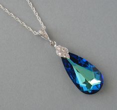 Bermuda Blue Swarovski Crystals necklace is available in 16 and 18 inches (40.6cm and 46cm) long and it has an extension of about 2 inches (5cm) long. Please select the size that you need.The necklace will be shipped in a small gift box. Materials and sizes: The Swarovski Crystals are made in Austria Crystal size: 24mm high and 12mm wide Color: Blue Rhodium plated over silver bails Sterling silver chain The necklace is also sold in a set. You get a discount if you buy a set! https://www.etsy.com Blue Crystal Drop Necklaces, Blue Crystal Drop Necklace, Sapphire Teardrop Crystal Necklace, Sapphire Crystal Teardrop Necklace, Elegant Blue Teardrop Crystal Necklace, Peacock Necklace, Crystals Necklace, Swarovski Crystal Necklace, Blue Pendant