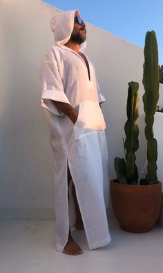 Men's caftan with hood White linen fabric small/medium/ large / xlarge / 2XL / 3XL /4XL size options Linen robe for surfers Kangaroo pocket %100 linen V neck Feel free to ask for customization to visit my shop: www.etsy.com/shop/mnouss/ worldwide fast shipping Casual White Long Sleeve Kaftan, Casual Summer Tunic Thobe, Casual Long Thobe For The Beach, Casual Long Thobe For Vacation, Casual White Long Sleeve Thobe, Casual Tunic Thobe For The Beach, Casual Summer Vacation Thobe, White Long Thobe For Summer, White Summer Thobe