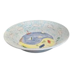 a bowl with a beach scene painted on it