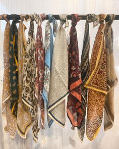 Multiple printed bandanas tied on a rod Silk Scarf Display Ideas, Bandana Decorating Ideas, Bandana Storage Ideas, Bandanna Display, Bandana Display Ideas, Bandana Storage, Bandana Display, Bandana Decor, Bandana Styling