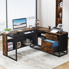 an office desk with two drawers and a computer monitor on top of it in front of a window