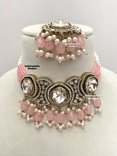 Premium quality Kundan pearls Choker comes with gorgeous Earrings and Tikka/ Indian Jewelry/Unique Polki and Kundan Jewelry/pink   All items are shipped from Brampton, Ontario, Canada. If you need your item by a certain day, please reach out to us for express delivery option before placing the order so that we can update the shipping for you. Standard shipping/delivery timeline Below are the delivery timeline estimates. We dispatch all orders by the next business day. ---> USA delivery timeline Pink Round Beads Jewelry Sets For Party, Pink Jewelry Sets With Round Beads For Parties, Pink Kundan Necklace For Festivals, Heavy Pink Bridal Necklace For Wedding, Pink Kundan Jewelry Sets, Pink Round Kundan Necklace For Diwali, Heavy Pink Kundan Necklace For Wedding, Elegant Pink Meenakari Jewelry Sets, Pink Bollywood Bridal Set With Stone Work