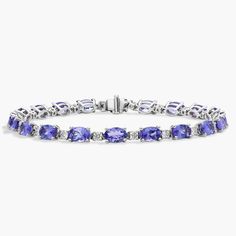 Captivating in color, this bracelet features vibrant tanzanite gemstones accented with sparkling round diamonds framed in 14k white gold. Precious Gemstones Jewelry, Diamond Frame, Tanzanite Gemstone, Blue Nile, Gemstone Bracelets, Semi Precious Gemstones, Diamond Bracelet, Round Diamonds, Gemstone Jewelry