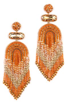 Sparkly crystals and fringed chevrons of bright, shimmery beads emphasize dramatic drop earrings crafted to swish and sway with every head turn. 4" drop; 1 1/4" width Stainless steel post back Glass/cotton/goldtone plate Imported Party Beaded Fringe Chandelier Drop Earrings, Orange Beaded Fringe Jewelry, Fringe Dangle Chandelier Earrings, Long Drop Beaded Fringe Earrings For Party, Beaded Dangle Chandelier Earrings, Party Long Drop Earrings With Beaded Fringe, Orange Dangling Beads Earrings For Party, Orange Beaded Dangling Earrings For Party, Orange Beaded Earrings With Dangling Beads For Party