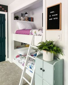 a bedroom with bunk beds and a ladder to the top bed is decorated in pastel colors