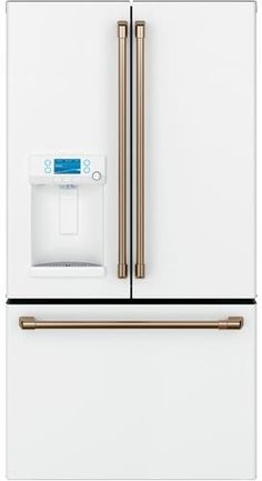 a white refrigerator freezer with gold handles