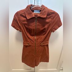 Seamed Corduroy Romper From Urban Outfitters Cut In A Structured Design With Zip-Front Closure. Short Sleeve Silhouette Topped With A Pointed Collar. Never Been Worn, Nwt Website Says Brown, But More Of A Rust Color Corduroy Romper, Lounge Jumpsuit, Urban Outfitters Romper, Blue Overalls, Coverall Jumpsuit, Sleeve Silhouette, Satin Romper, Structured Design, Urban Outfitters Pants