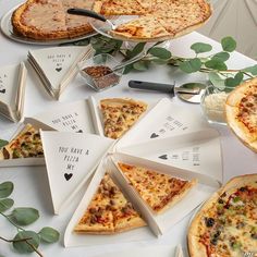 a table topped with pizza slices covered in toppings