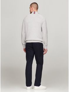 Tommy Hilfiger men's sweater. Made from soft cotton and styled in an easy fit, our sweaters are soft, comfortable layers.  Material: 100% Cotton. Tommy Hilfiger Sweater With Ribbed Cuffs For Fall, Tommy Hilfiger Fall Sweater With Ribbed Cuffs, Classic Half-zip Sweater With Ribbed Collar, Tommy Hilfiger Winter Sweatshirt With Ribbed Cuffs, Classic Half-zip Polo Sweater With Ribbed Cuffs, Cotton Polo Sweater With Ribbed Cuffs For Work, Classic Half-zip Sweater With Ribbed Cuffs, Classic Turtleneck Sweatshirt With Ribbed Collar, Casual Polo Sweater With Ribbed Cuffs For Business Casual