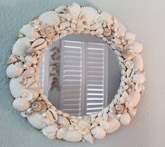 there is a mirror that has shells on it