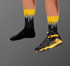 These Jordan 8s Retro 'Taxi' inspired all-over-print socks are extra comfortable thanks to their cushioned bottom. The foot is black with artwork printed along the leg with crisp, bold colors that won't fade.  * 60% nylon/22% cotton/18% spandex * Crew length * Cushioned bottom * Ribbed leg * Cold wash with like colors and hang dry * A great year-round gift idea with graphics inspired by the Jordan 8s Retro 'Taxi' colorway! * Perfect gift for any sneakerhead! * The Jordan 8s Retro 'Taxi' shown is Casual Non-slip Socks For Sports Events, Non-slip Casual Sports Socks, Black Non-slip Socks For Sports Events, Black Non-slip Socks For Sports, Yellow Sporty Socks For Sports, Casual Black Socks For Sports Events, Black Breathable Socks For Streetwear, Black Socks For Streetwear, Jordan 8s