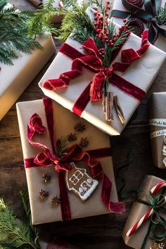 christmas presents are wrapped in red and white ribbon