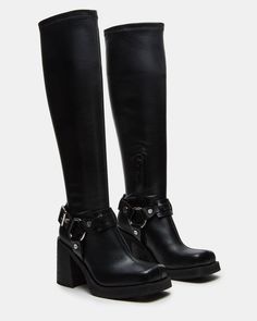 The ONYX is a sleek moto-inspired boot, featuring a bold block heel and reaching to the knee. Elevate your style with these statement boots that provide both fashion and function—expertly crafted for comfort and durability. 3.25 inch heel height 13.5 inch shaft circumference 16.25 inch shaft height Vegan leather upper Black Leather Moto Boots, Black Buckle Boots, Statement Boots, Shoes Sandals Heels, Black Knees, Charli Xcx, Black Boots Women, 90s Style, Buckle Boots