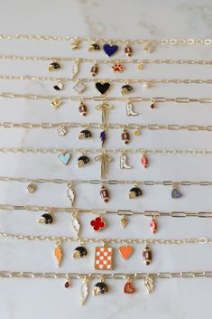 Go team! Your accessory game will pull the W this season with our Sports Day Charm Necklaces! Choose from one of our premade choices to have the perfect piece to top off your outfit! One of these Game Day Charm Necklaces will easily become your favorite piece to wear solo or layered. Here are the details: *An odd number of charms works best for the Paperclip Chain style *These necklaces are 18k gold plated *Available sizes: 16” with 2” extender or 18” with 2” extender* Paperclip Chain Styles ava Charm Necklace Diy, Handwriting Jewelry, Diy Charm, Go Team, Druzy Jewelry, Charms Necklace, Sports Day, Jewelry Fashion Trends, Charm Necklaces