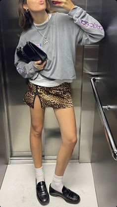 cheetah print mini skirt, loafers with socks, grey sweatshirt spring summer look including some on the fashion biggest trends Loafers Mini Skirt, Office Mini Skirt, Loafers Outfit Summer, Casual Dinner Outfits, Stargirl Interlude, Chica Chola, Summer/fall Outfits, Dinner Outfit Casual