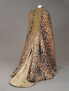 Charles Frederick Worth: Lady's Cloak, Paris, Late 19th C.	  Satin with woven velvet pattern, gold thread, pendants and tassels of glass beads. (hermitagemuseum.org) House Of Worth, 1890s Fashion, 1880s Fashion, Characters Design, Victorian Clothing, Printed Dresses, Vintage Gowns, Old Fashion, Historical Costume