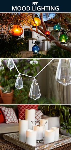 some lights that are hanging from a tree in front of a house and on a table