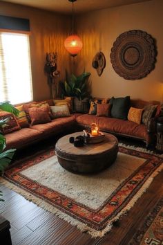 a living room filled with lots of furniture next to a large rug on top of a hard wood floor