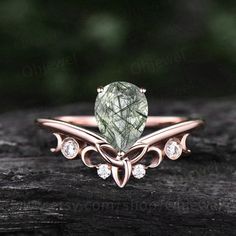 "This is a green Rutilated Quartz engagement ring in solid gold,about 6x8mm pear cut. The accent stones are round diamonds or moissanites. It can be made in any ring size. However please contact me to custom make it to a special big or small size. It can be made in white gold,rose gold or yellow gold with 14k or 18k. However for some people who are nickel allergic,I can also make it to 925 sterling silver to make you can wear it. The ring is handmade,very high quality! 30 days money back guarant Heart Shaped Wedding Ring, Heart Shaped Wedding Rings, Diamond Ring Women, Shaped Wedding Ring, Rutilated Quartz Engagement Ring, Wedding Ring Sets Unique, Marquise Cut Rings, Quartz Engagement Ring, Moss Agate Engagement Ring