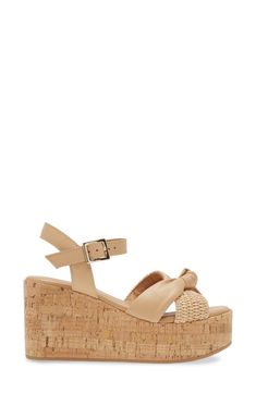 A cork-textured platform enhances the earthy style of a lightly cushioned sandal topped with leather and raffia straps. 3" heel; 1 1/2" platform Cushioned footbed Leather and raffia upper/leather lining/rubber sole Made in Italy Cork Open Toe Wedge Sandals For Beach, Cork Wedge Sandals With Heel Strap And Round Toe, Open Toe Cork Wedge Sandals For Beach, Open Toe Cork Wedge Sandals With Heel Strap, Cork Wedge Heel Sandals For Vacation, Cork Wedge Sandals For Vacation, Cork Sandals With Heel Strap And Wedge Heel, Chic Sandals With Cork-bed Midsoles, Chic Straw Sandals With Cork-bed Midsoles