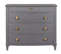 a grey chest of drawers with gold handles and knobs on the bottom, against a white background