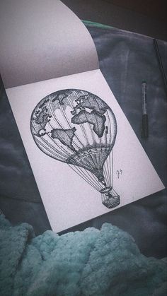 an ink drawing of a hot air balloon with the earth on it's side