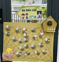 a bulletin board with pictures of bees on it and a sign that says be ben lop