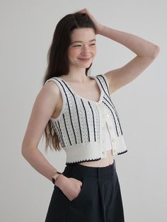 This is a trendy and feminine top by SSEMI that is made out of high quality and sturdy material. With distinctive mood of the design and comfortable wear, you can style it for your casual daily outfit.- Unique vertical stripe pattern- Buttons detail on the front- Feminine and casual mood Chic Fitted Top With Vertical Stripes, Chic Fitted Tops With Vertical Stripes, Chic Fitted Vertical Stripes Tops, Chic Striped Knit Tops, Striped V-neck Knit Top For Summer, Trendy Striped Knit Tops, Striped V-neck Knit Top For Spring, Chic Striped Cropped Crop Top, Chic Striped Cropped Top