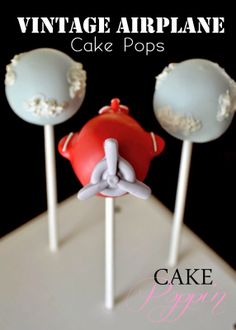 two cake pops are sitting on top of each other with the words vintage airplane cake pops above them