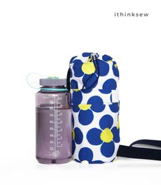 "FINISHED SIZE SMALL BAG: 6 1/4\" WIDE X 9 3/4\" TALL X 3 3/4\" DEEP (APPROX.) LARGE BAG: 7\" WIDE X 11\" TALL X 4\" DEEP (APPROX.)   If you love being outdoors, our versatile Larisa Water Bottle Bag is a must-have! It's a sling bag that comes in two sizes, perfect for staying hydrated and organized during hikes, walks, and travels. There's even a loop to hang your carabiners, sunglasses, and other accessories! Plus, the sling design keeps you hands-free for whatever adventure you're on. So go a Sling Design, Water Bottle Bag, Sailor Fashion, Wine Bag, Bottle Bag, Letter Patterns, Size Pattern, Large Bag, Pdf Sewing Patterns