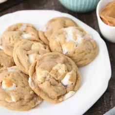 chocolate chip cookies with marshmallows on a white plate