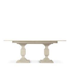 a white table with two pedestals on each side