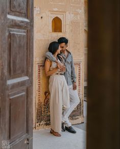 a man and woman standing next to each other