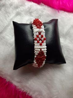 Ilde de Shangó, with white, red and gold beads. This ilde is adjustable to all measurements since it is elastic in its structure and fabric, ideal for your daily life since it is made with a waterproof and durable material for any Yoruba religion ceremony, you can also place your order for any other saint. or combination Traditional White Beaded Bracelets For Festive Occasions, Traditional Red Adjustable Beaded Bracelets, Traditional Adjustable Red Beaded Bracelets, Traditional White Adjustable Bracelets, White Adjustable Beaded Bracelets For Christmas, Adjustable White Beaded Bracelets For Christmas, Festive White Beaded Bracelets, Handmade White Beads For Festive Occasions, Red And Gold