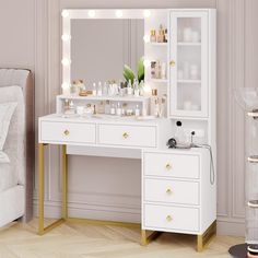 a white dressing table with lights on it