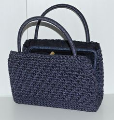 Description: Vintage blue crochet style handbag Made in Italy Dimensions: 29 x 20 x 8 cm Handle drop: 12 cm 2 compartments (one with 1 pocket) separated by 1 central pocket. Condition: The bag is in good condition (see pictures). Blue Handmade Evening Bag For Everyday Use, Blue Crochet Satchel Bag For Daily Use, Blue Top Handle Straw Bag For Everyday Use, Blue Rectangular Crochet Bag, Blue Rectangular Crochet Bag For Shopping, Blue Rectangular Crochet Travel Bag, Elegant Blue Crochet Bag For Everyday Use, Elegant Blue Rectangular Crochet Bag, Elegant Blue Crochet Bag