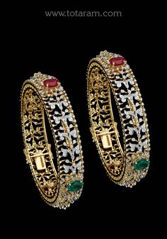 18 karat gold diamond kada for women with color stones - set of 2 (1pair)
  note : this item comes with a clip. so that you can open it and wear it directly on your wrist.
    this product has inter changeable stones in the kada

  note : minimum size : 2-4 & maximum size : 2-5.


introducing our exquisite 18 karat gold diamond kada for women with color stones - a stunning set of 2 (1pair) bangles that will add a touch of elegance and sophistication to any outfit. made with love and skill in ind Traditional Bangle With Diamond Accents For Anniversary, Traditional Diamond Bangle With Diamond Accents, Traditional Anniversary Bangle With Diamond Accents, Formal Diamond Bangle With Stone Work, Diamond Bangle With Intricate Design In Yellow Gold, Diamond Bangle In Yellow Gold With Intricate Design, Yellow Gold Diamond Bangle With Intricate Design, Yellow Gold Diamond Jewelry With Stone Work, Kada For Women