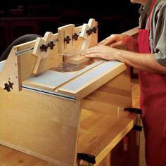 a man is working on some kind of workbench