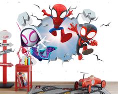 a kid's bedroom with spiderman wall decals and toys in the room