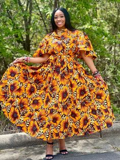 ✨ Embrace the beauty of African fashion and let your style shine bright with this exquisite piece. ✨ Our stunning African Print Floral Maxi Dress in a mesmerizing yellow print style. This elegant long dress effortlessly combines traditional African aesthetics with contemporary flair, creating a captivating ensemble that is perfect for any special occasion. Crafted with exquisite attention to detail, the dress features a striking floral print in rich shades of yellow, reminiscent of the sun-drenc Yellow A-line Maxi Dress For The Beach, Yellow A-line Maxi Dress For Beach, Yellow A-line Beach Maxi Dress, Yellow Short Sleeve Maxi Dress For Party, Fitted Yellow Dress For Casual Wear, Yellow Sunflower Print Dress For Beach, Yellow Sunflower Print Beach Dress, Yellow A-line Sundress, Yellow A-line Midi Dress For Casual Occasions