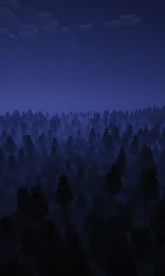 an aerial view of trees at night with the moon in the sky over them and blue hues