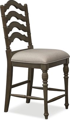 an old fashioned chair with a white cushion on the seat and backrest, against a white background